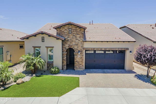 841 E Farmers Ln, Queen Creek, AZ 85140 - mediterranean / spanish-style house with a tile roof, an attached garage, decorative driveway, and stucco siding