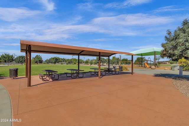 view of community featuring a playground and a yard