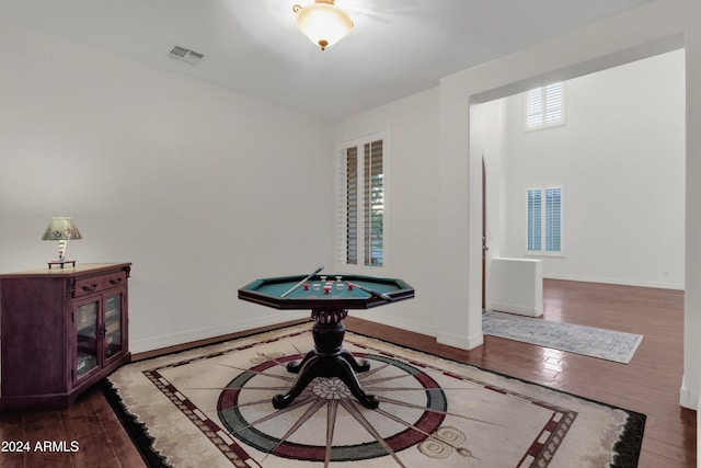 rec room with dark hardwood / wood-style floors