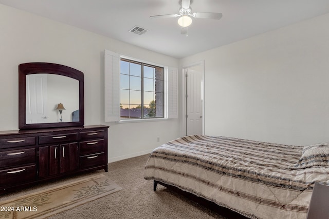 bedroom featuring ceiling fan and light colored carpet