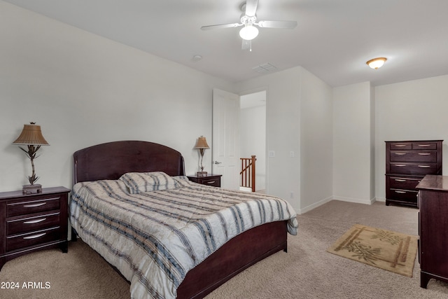 bedroom with ceiling fan and light colored carpet