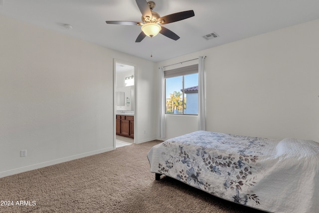 carpeted bedroom featuring connected bathroom and ceiling fan