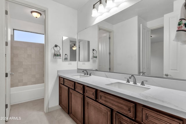 bathroom featuring vanity, tile patterned floors, ceiling fan, and tiled shower / bath combo