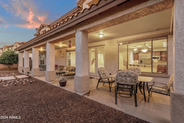 view of patio terrace at dusk