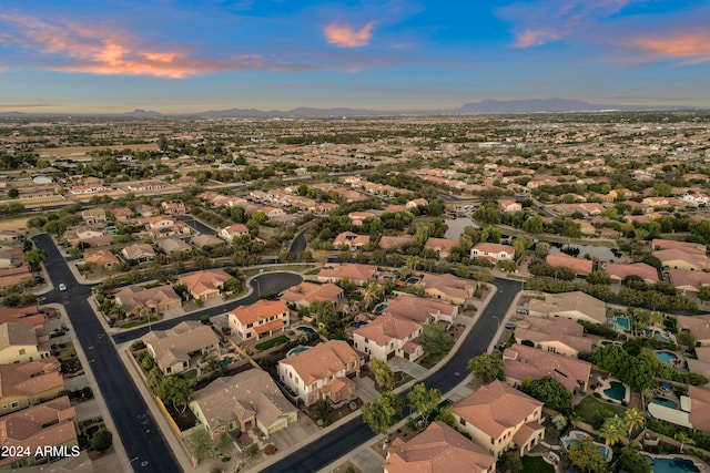 aerial view at dusk with a mountain view