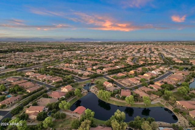 aerial view at dusk with a water view