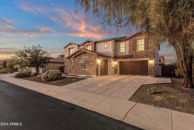 mediterranean / spanish-style home featuring a garage