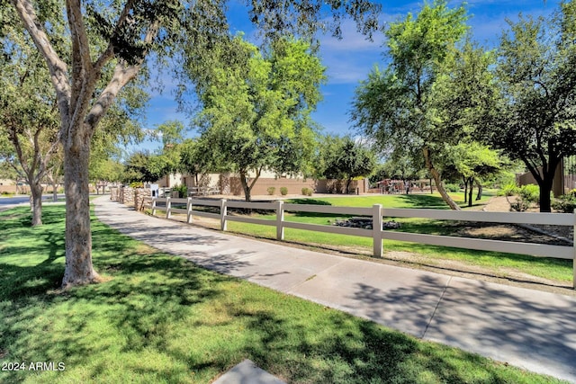 view of home's community featuring a lawn