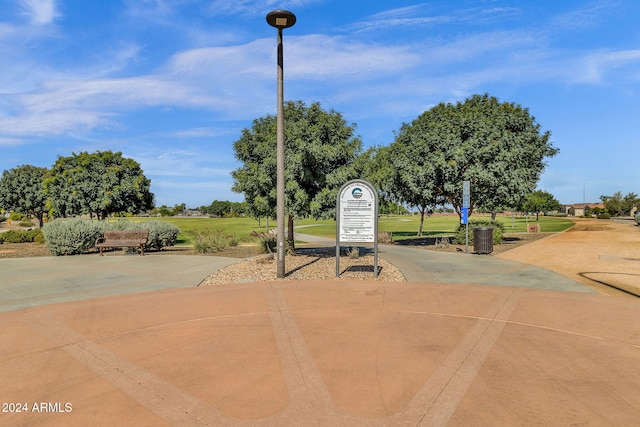 view of property's community with a yard