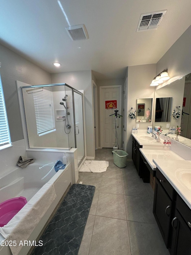 15301 W Moreland St, Goodyear, AZ 85338 - bathroom with a sink, a garden tub, a stall shower, and visible vents
