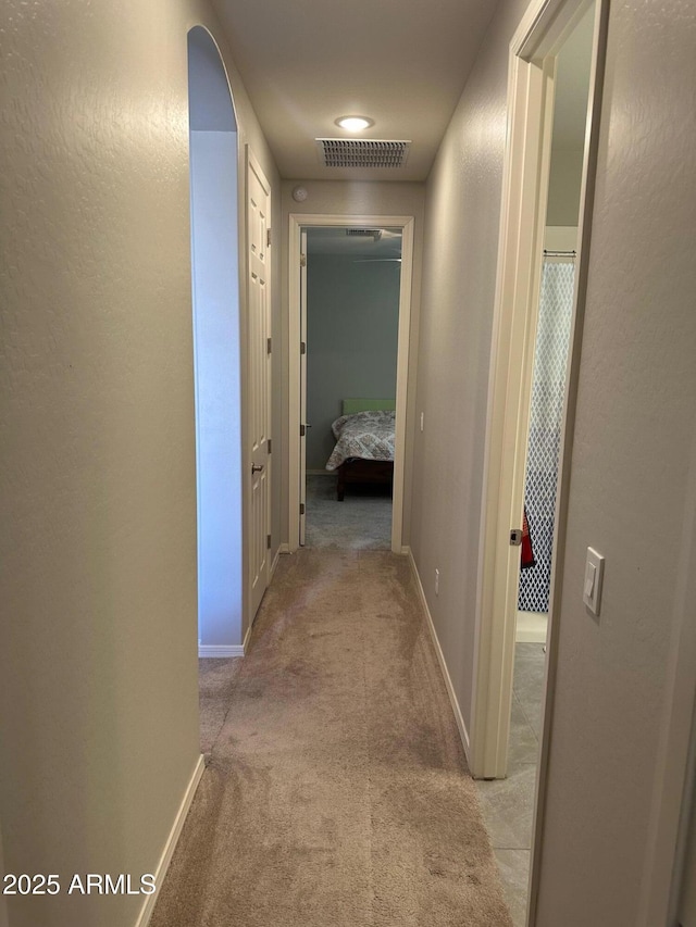 15301 W Moreland St, Goodyear, AZ 85338 - corridor with visible vents, baseboards, and light carpet
