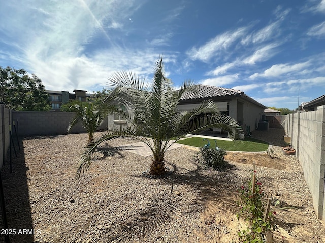 15301 W Moreland St, Goodyear, AZ 85338 - back of property featuring a tiled roof, stucco siding, and a fenced backyard