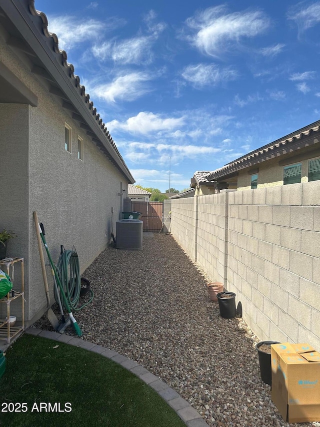 15301 W Moreland St, Goodyear, AZ 85338 - view of yard with cooling unit and a fenced backyard
