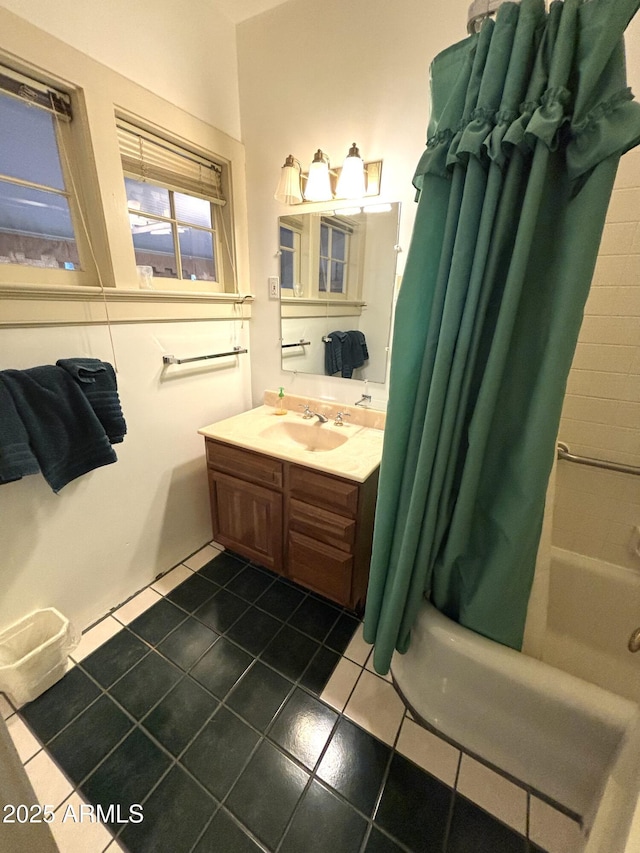 bathroom with shower / tub combo, vanity, and tile patterned floors