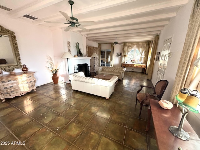 living room featuring ceiling fan and beam ceiling