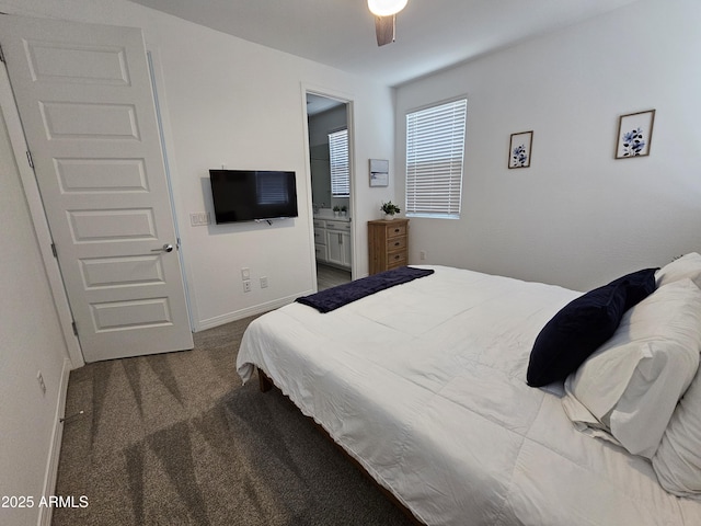 9137 W Sells Dr, Phoenix, AZ 85037 - bedroom featuring carpet, baseboards, connected bathroom, and ceiling fan