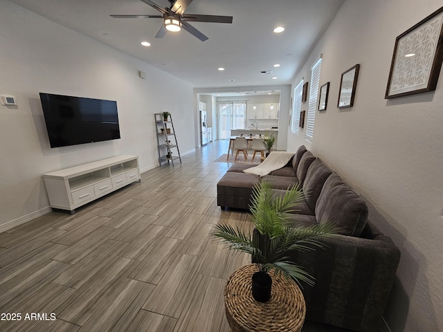 9137 W Sells Dr, Phoenix, AZ 85037 - living room featuring ceiling fan, recessed lighting, baseboards, and wood finished floors