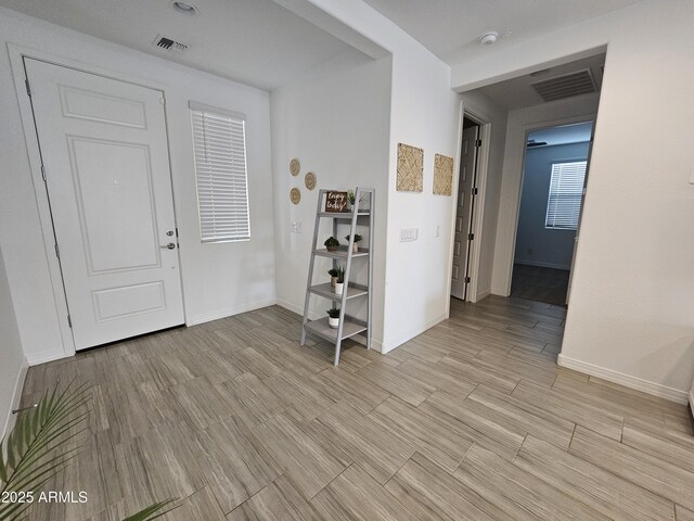 9137 W Sells Dr, Phoenix, AZ 85037 - foyer with baseboards and light wood-style flooring