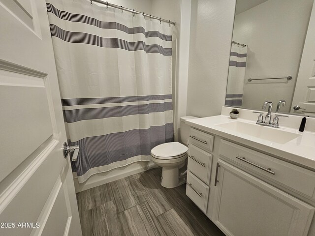 9137 W Sells Dr, Phoenix, AZ 85037 - bathroom with vanity, toilet, and shower / bathtub combination with curtain