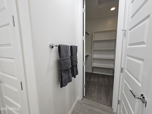 9137 W Sells Dr, Phoenix, AZ 85037 - bathroom featuring recessed lighting, wood finished floors, and baseboards
