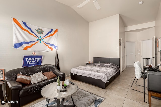 tiled bedroom with ceiling fan and lofted ceiling