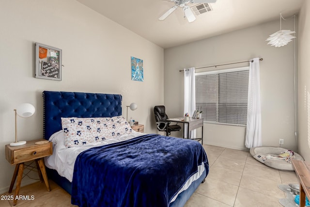 tiled bedroom featuring ceiling fan