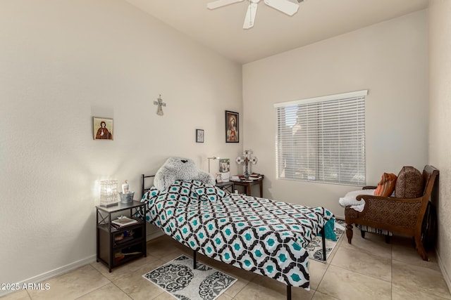 tiled bedroom with ceiling fan