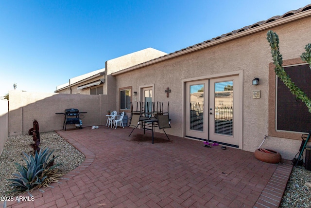 back of property with french doors and a patio