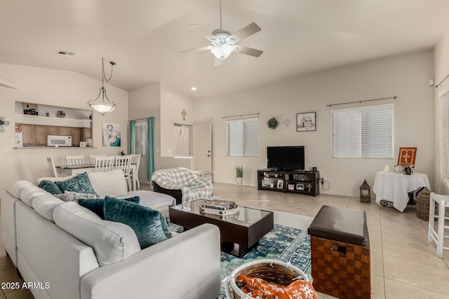 tiled living room with vaulted ceiling and ceiling fan