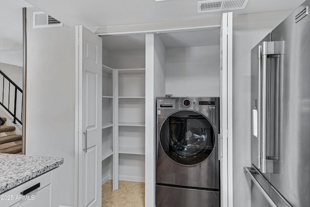 laundry room with washer / dryer