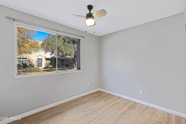 spare room with ceiling fan and light hardwood / wood-style flooring