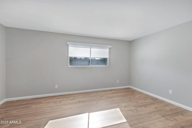 unfurnished room featuring light hardwood / wood-style floors