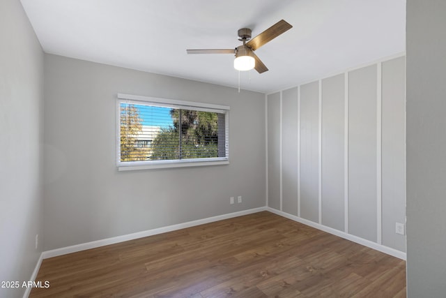 spare room featuring ceiling fan and wood-type flooring