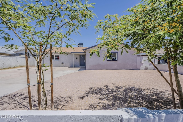 3017 N 46th Dr, Phoenix, AZ 85031 - back of house featuring stucco siding and a patio area