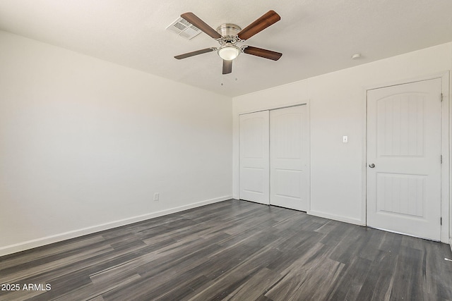 3017 N 46th Dr, Phoenix, AZ 85031 - unfurnished bedroom featuring dark wood-style flooring, a closet, baseboards, and ceiling fan