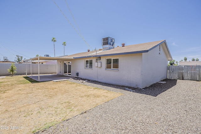 3017 N 46th Dr, Phoenix, AZ 85031 - rear view of property with a fenced backyard, brick siding, a patio area, and central air condition unit