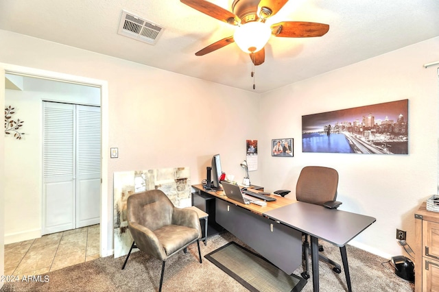 tiled office space with ceiling fan