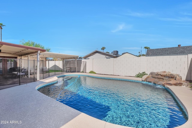 view of pool featuring a patio and pool water feature