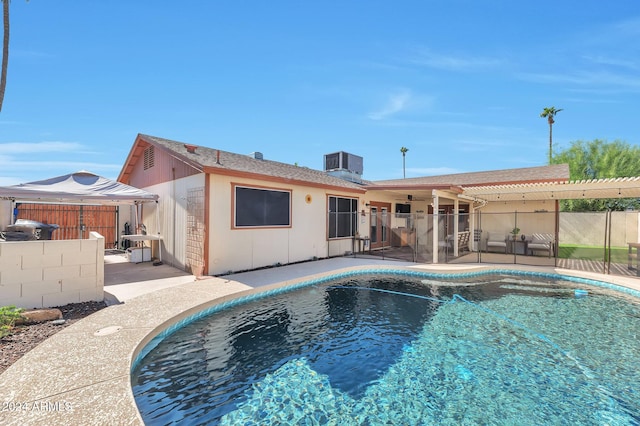 view of swimming pool featuring a patio area and central AC