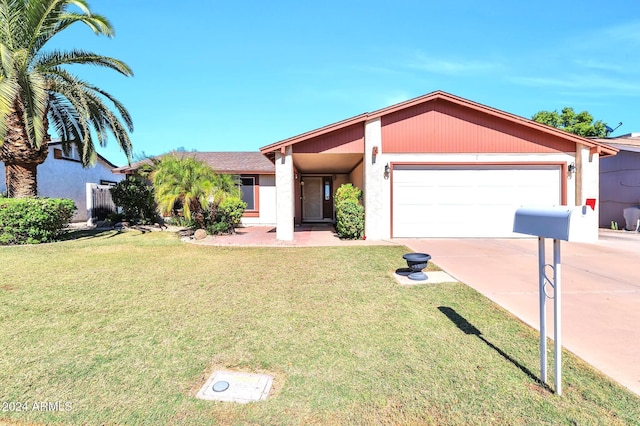 single story home with a front yard and a garage