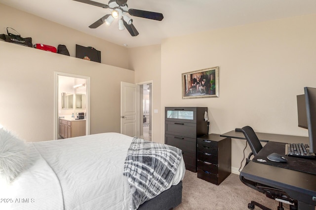 bedroom with vaulted ceiling, ceiling fan, ensuite bathroom, and light colored carpet