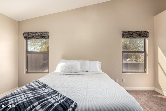 bedroom with carpet floors and baseboards