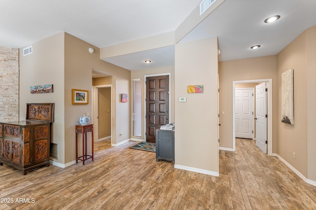 foyer with light wood-type flooring