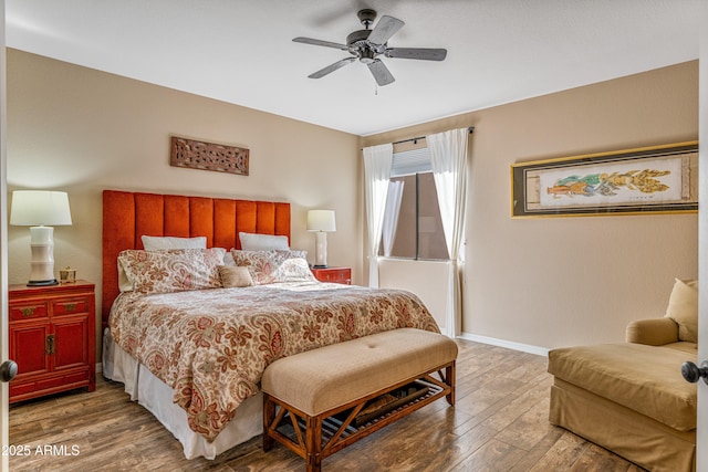 bedroom featuring hardwood / wood-style flooring and ceiling fan