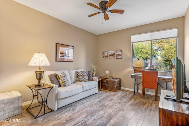 interior space with wood-type flooring and ceiling fan