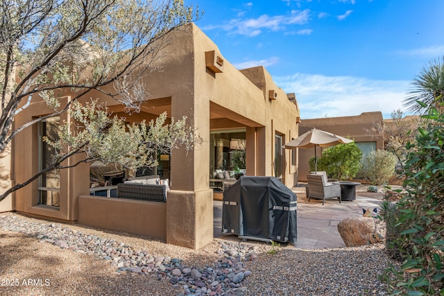 back of property with a patio