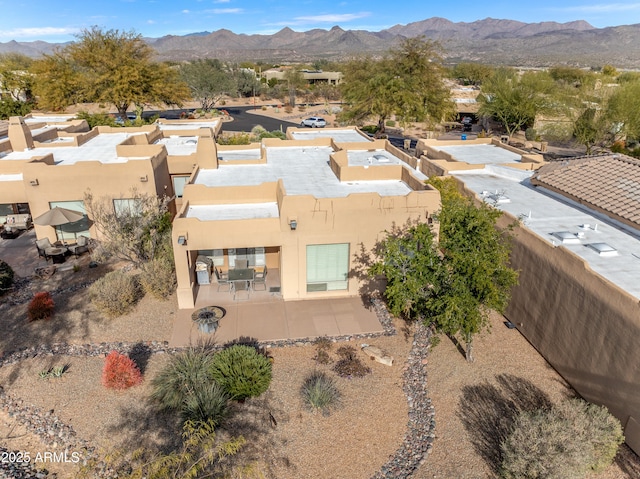 birds eye view of property featuring a mountain view