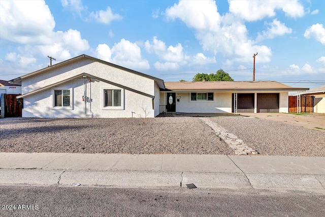 single story home featuring a garage