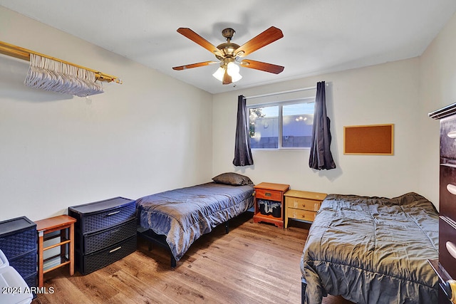 bedroom featuring ceiling fan and hardwood / wood-style flooring