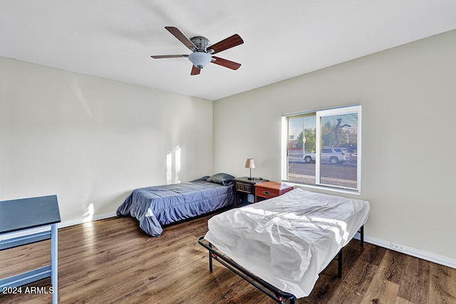 bedroom with hardwood / wood-style flooring and ceiling fan